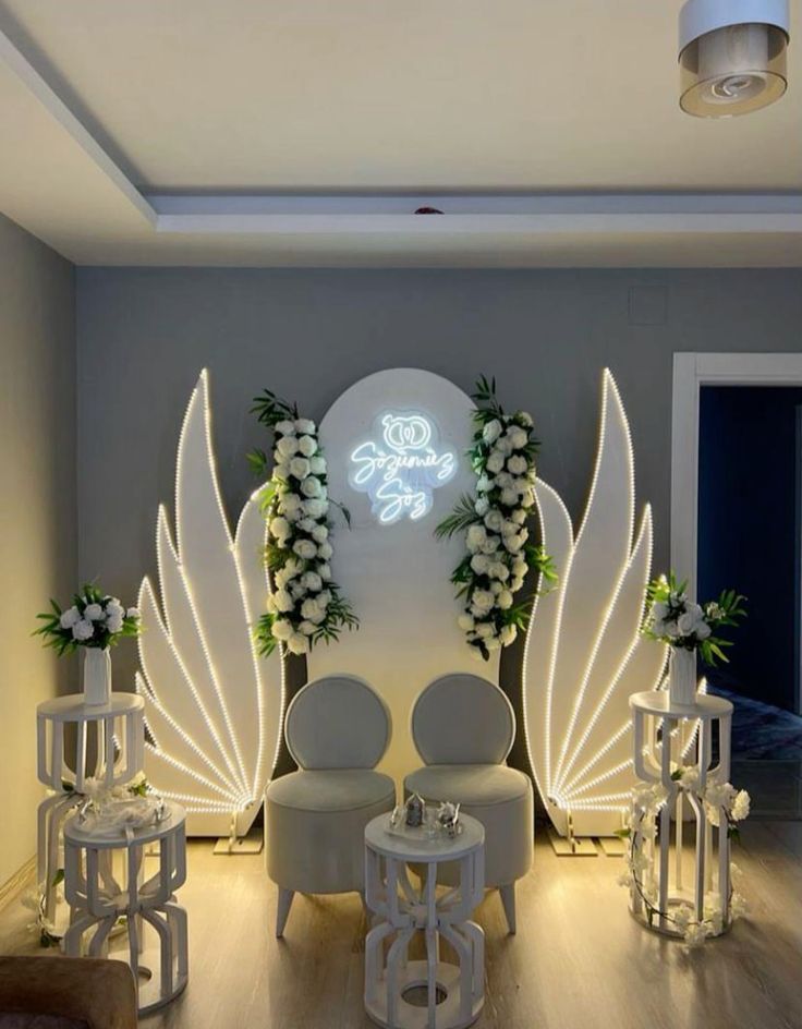 Elegant bridal shower decor with balloons, cake setup, and flower walls by Xplore Events