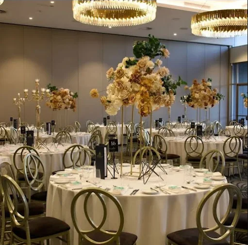 Corporate event setup with branding, lighting, and seating arrangement by Xplore Events