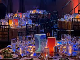 Corporate dinner setup with brand-themed decor
